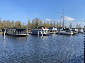 Marina - Luxury Houseboat with swim platform in colorful harbor (Stavoren)