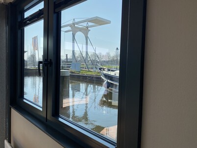 Luxury Houseboat with swim platform in colorful harbor