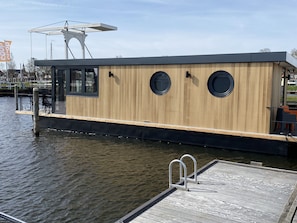 Exterior - Luxury Houseboat with swim platform in colorful harbor (Stavoren)