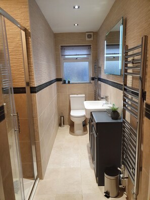 Shower, hair dryer, towels, soap