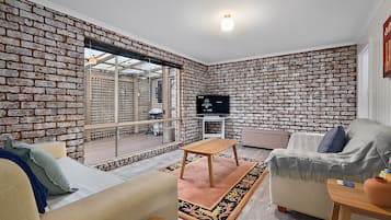 Smart TV, fireplace, DVD player, books