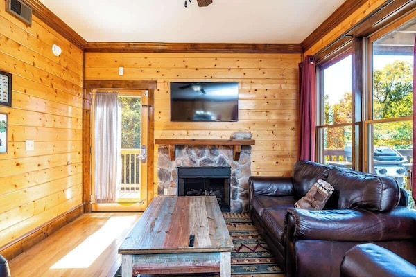 Our living area sits behind a rustic kitchen table to enjoy your dinner and a show or movie!