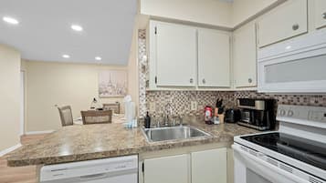 Family Apartment | Private kitchen | Fridge, microwave, stovetop, dishwasher