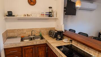 Fridge, microwave, stovetop, coffee/tea maker