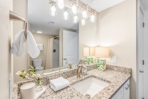 Shower, hair dryer, towels