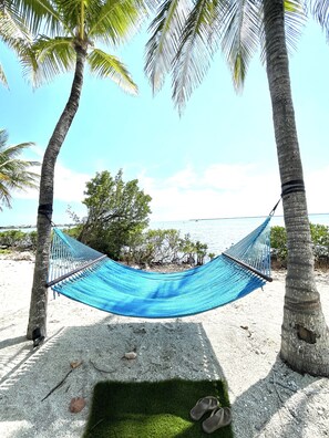 On the beach, sun loungers, beach towels