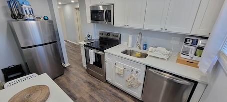Fridge, microwave, stovetop, dishwasher. Cheerful 2-Bedroom Apartment with Smart Home Tech.