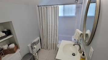 Combined shower/tub, hair dryer, towels, soap