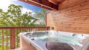 A hot tub on a wooden deck with a view of trees. - Cozy Retreat N Smoky, Sleeps 6・Hot Tub・Pool Table (Pigeon Forge)