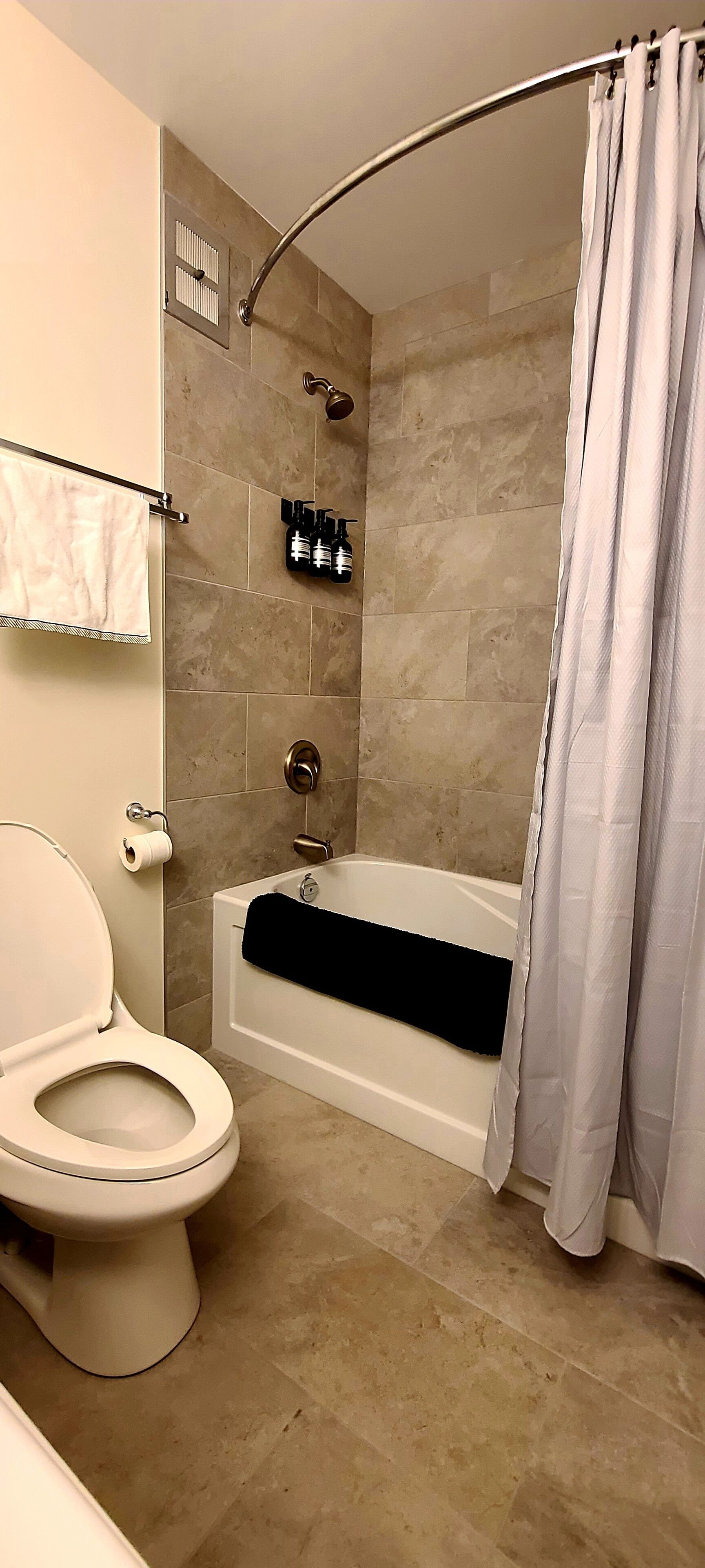 Combined shower/tub, hair dryer, towels, soap