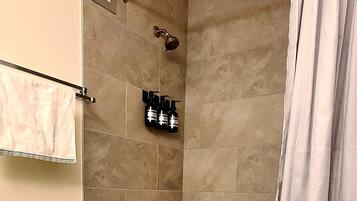 Combined shower/tub, hair dryer, towels, soap
