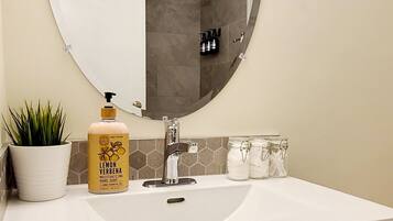 Combined shower/tub, hair dryer, towels, soap