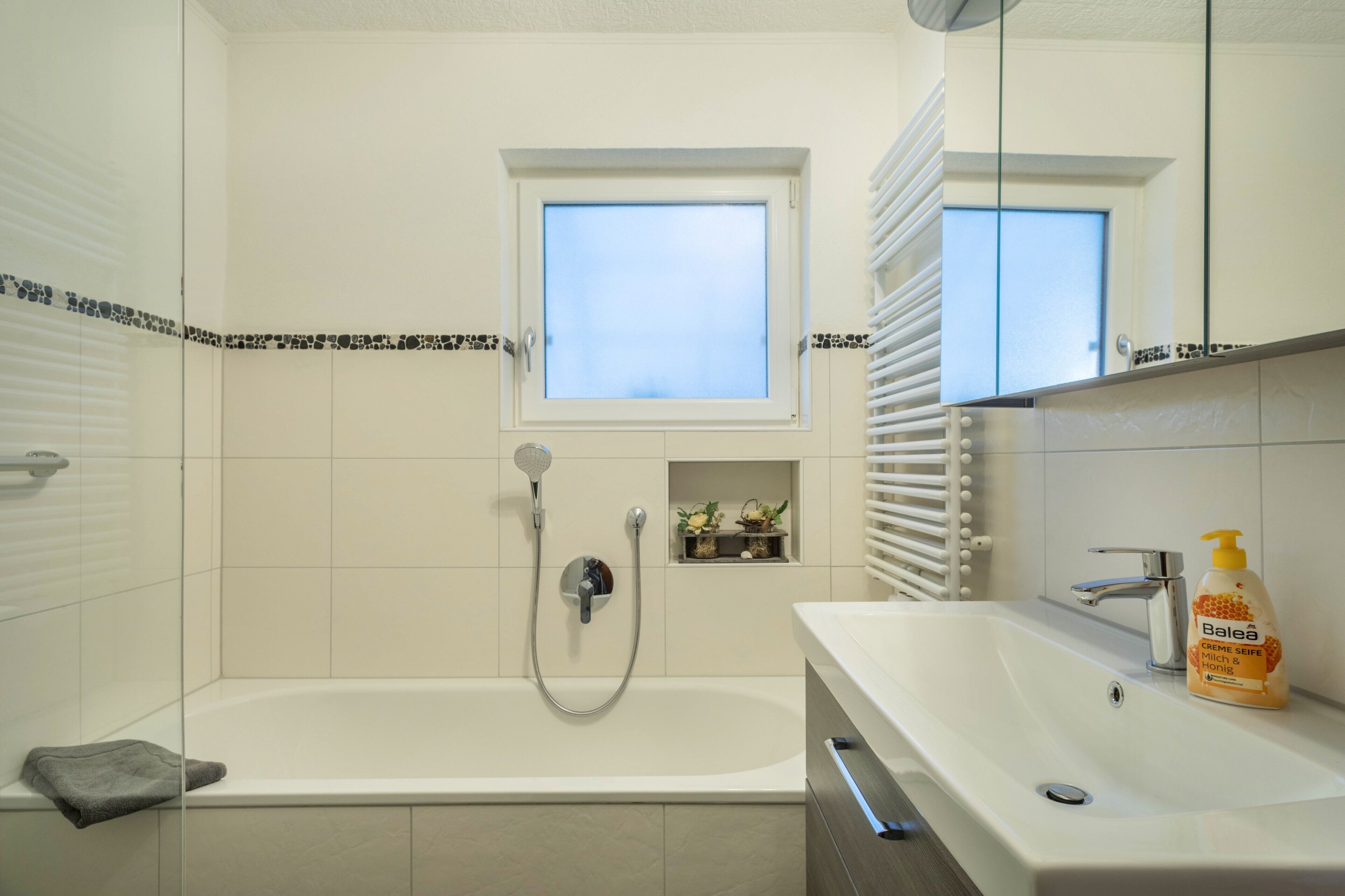 Bathtub, hair dryer, towels