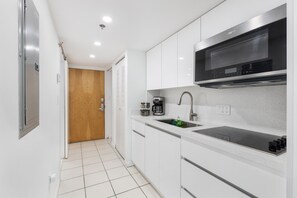 Fridge, microwave, stovetop, coffee/tea maker