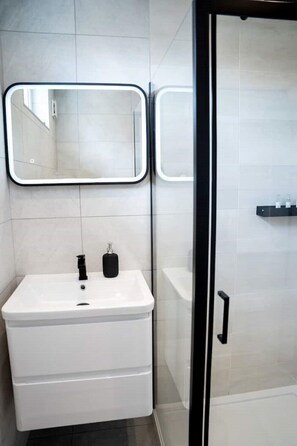 Shower, hair dryer, towels, soap