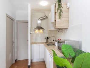 Fridge, microwave, cookware/dishes/utensils