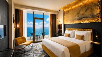 Premium Suite, Kitchenette, Sea View | Pillowtop beds, in-room safe, individually decorated