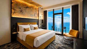 A hotel room with a large bed, a chair, a desk, a view of the ocean, and a unique wall art piece.