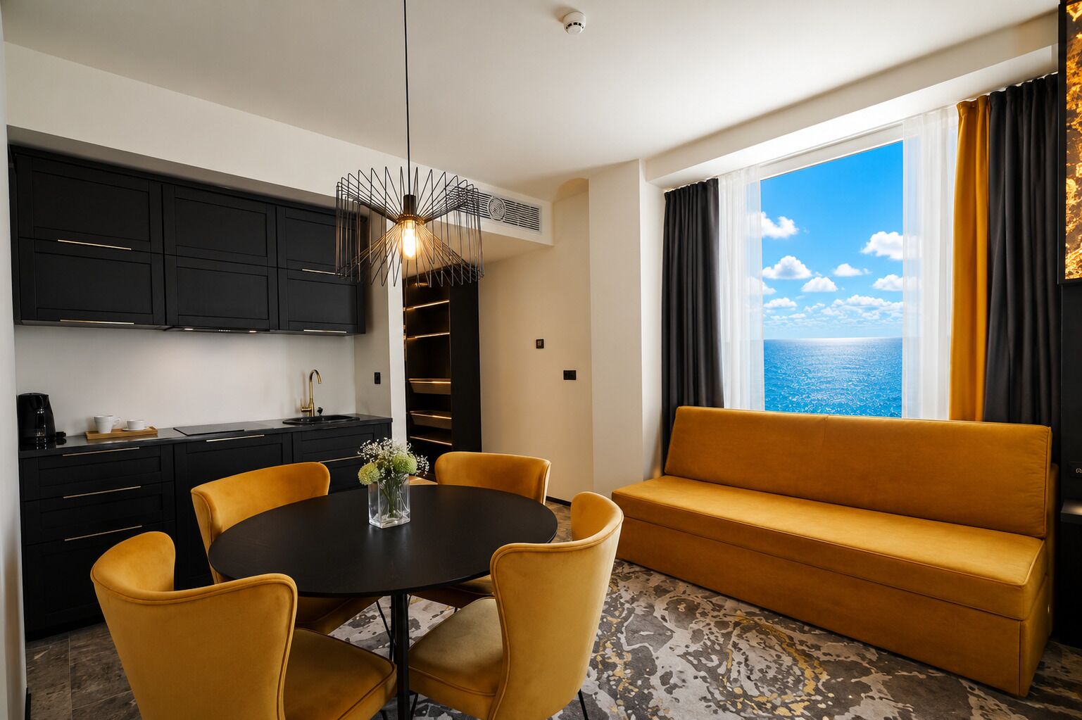 A modern hotel room with a dining area, a sofa, and a view of the sea.