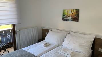 Desk, laptop workspace, free WiFi, bed sheets