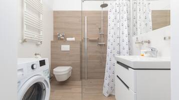 Shower, hair dryer, towels, shampoo