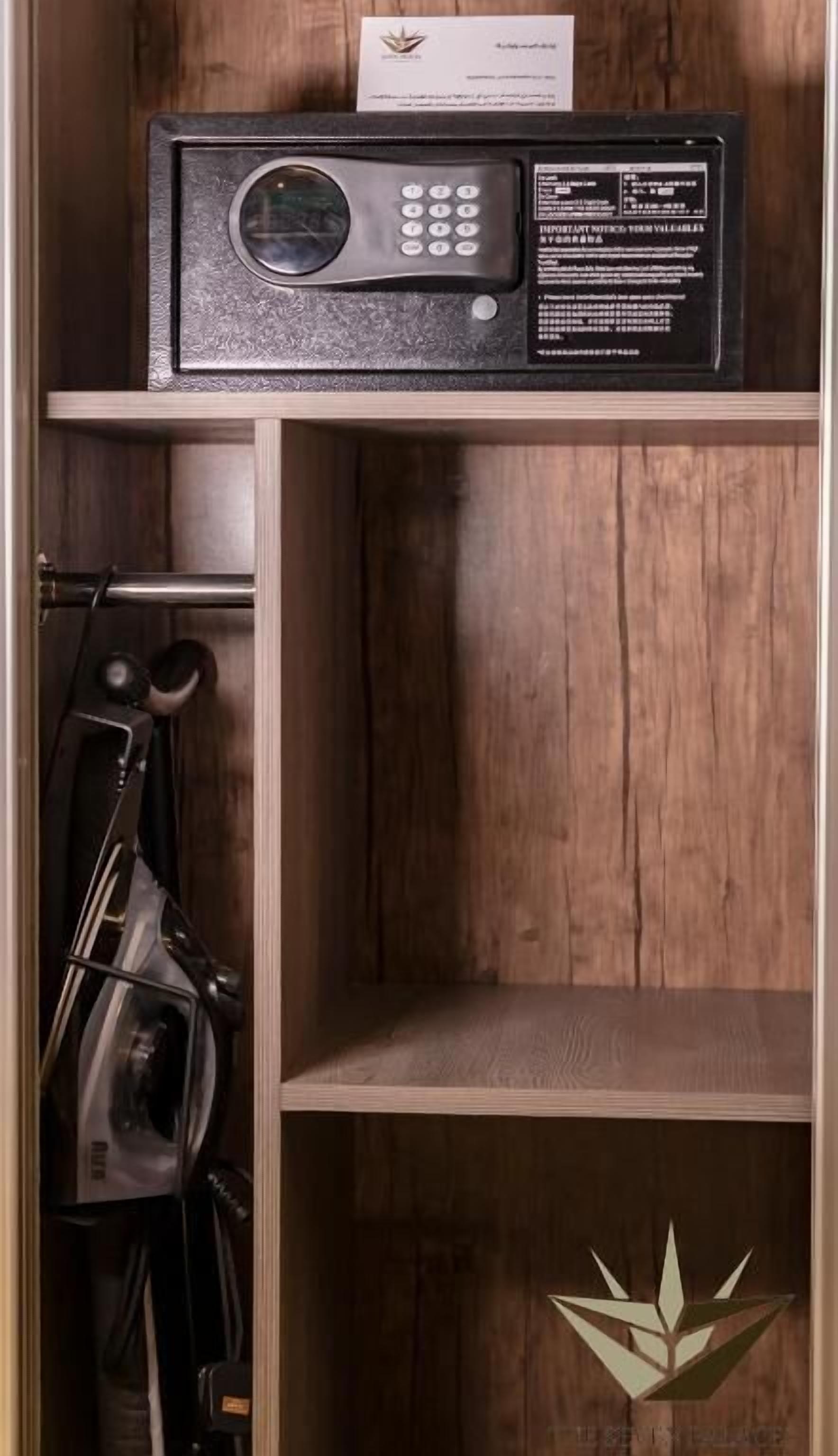 A wooden cabinet with a microwave on top.