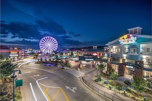 Experience the vibrant energy of the city at Margaritaville, where a Ferris wheel dominates the skyline and bustling streets come alive.