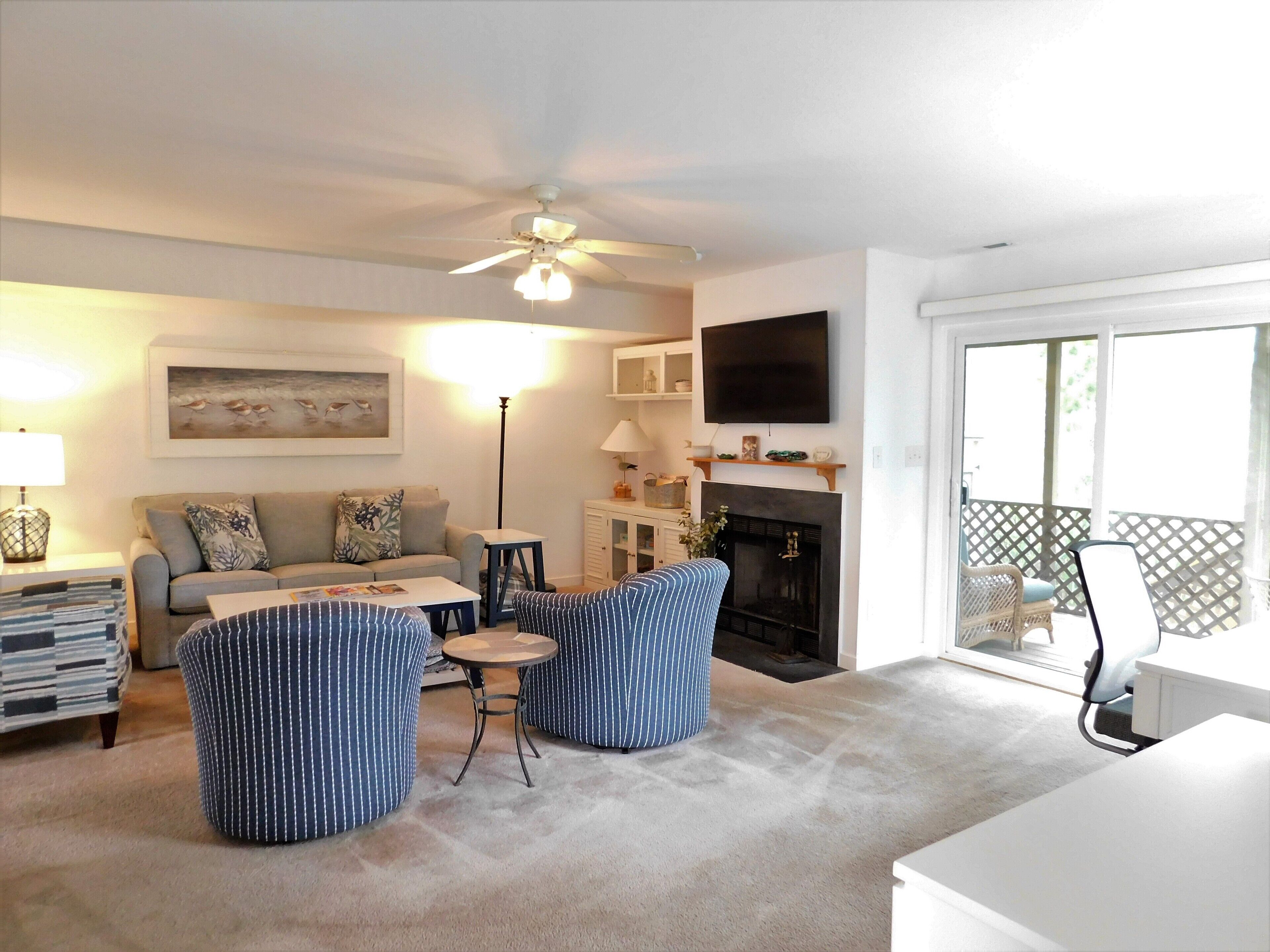541D Hudson Avenue - Open Concept Main Level - Highlights the home's seamless floor plan, where the spacious living area flows directly into the dining space, all anchored by large windows that bring the outside in.