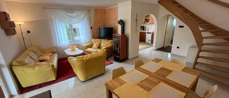 Smart TV, fireplace, table football, books