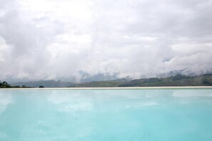 Seasonal outdoor pool, pool umbrellas, pool loungers