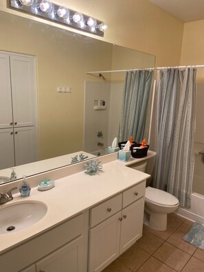 Combined shower/bathtub, towels, soap, shampoo