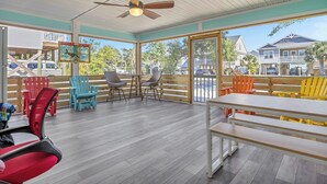 Outdoor dining - Poolside Paradise: Modern Coastal Oasis with Private Backyard Pool (Oak Island)