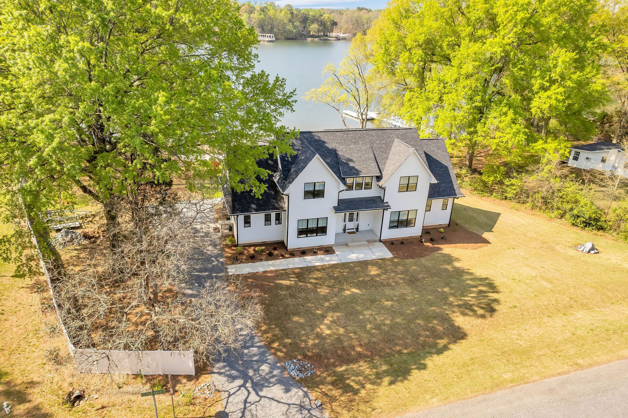 New lake house circa 2022, with private beach, dock, deck, and big water views!