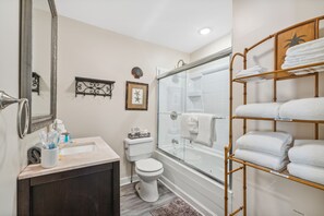 Combined shower/bathtub, hair dryer, towels, soap