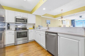 Coffee/tea maker, fridge, microwave, oven