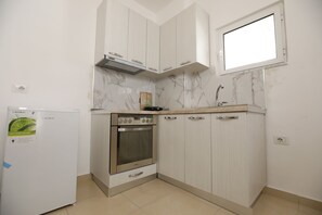 Departamento | Cocina privada | Refrigerador, horno, tetera eléctrica y tostadora