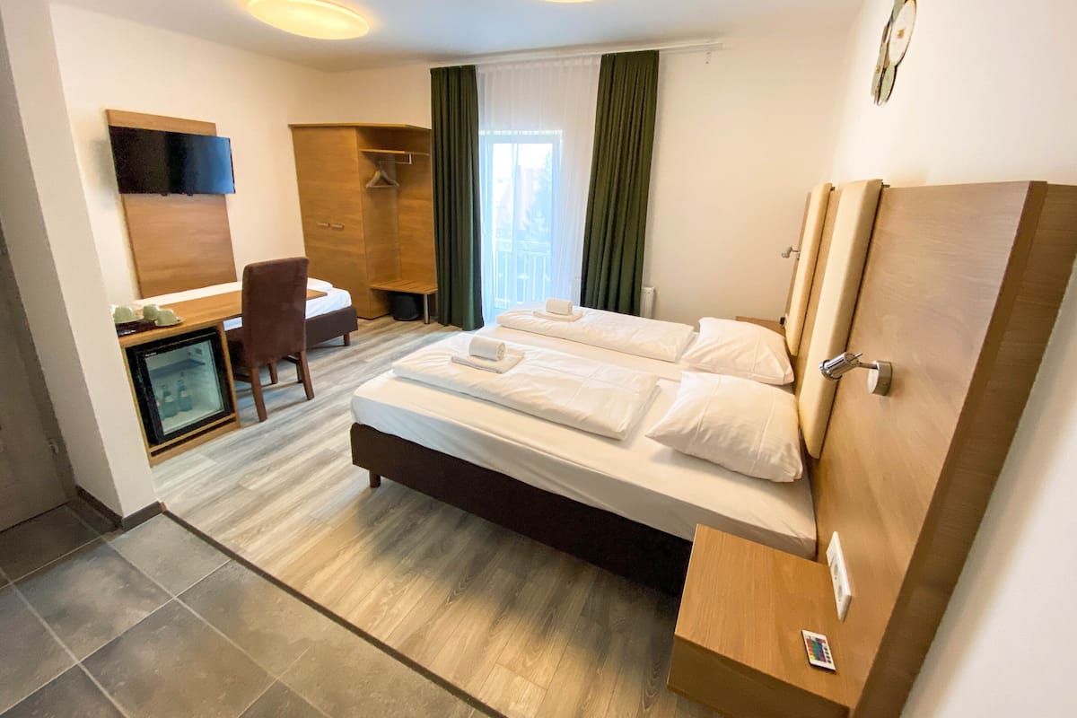 Triple Room | Minibar, desk, laptop workspace, iron/ironing board