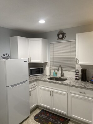 Fridge, microwave, coffee/tea maker, toaster