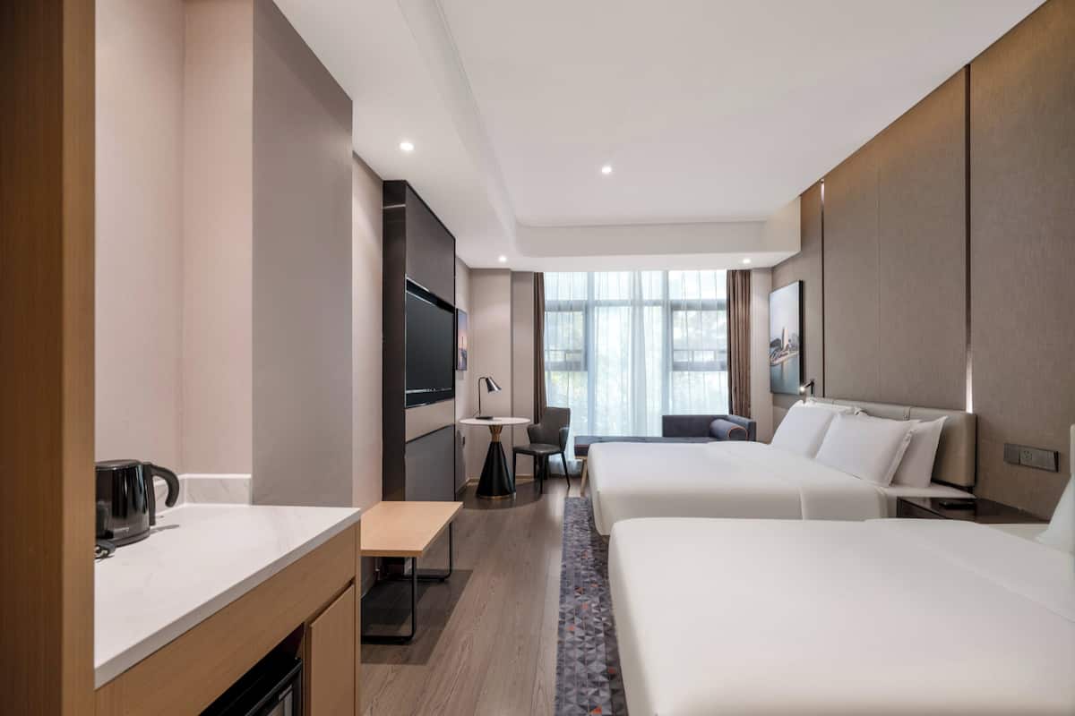 Down comforters, desk, blackout drapes, soundproofing