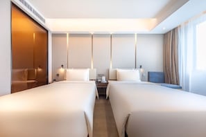 Down comforters, desk, blackout drapes, soundproofing