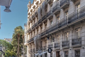 A historic building with ornate balconies and a sign for 'Conchely Marigold Hotel'. - Petit Palace El Remei formerly known as Soho Boutique Turia (Valencia)