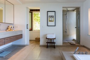 Bathtub, hair dryer, towels, soap