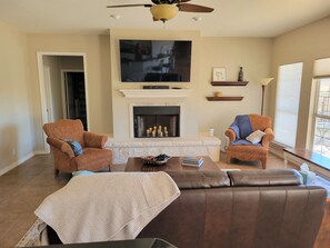 Smart TV, fireplace, books