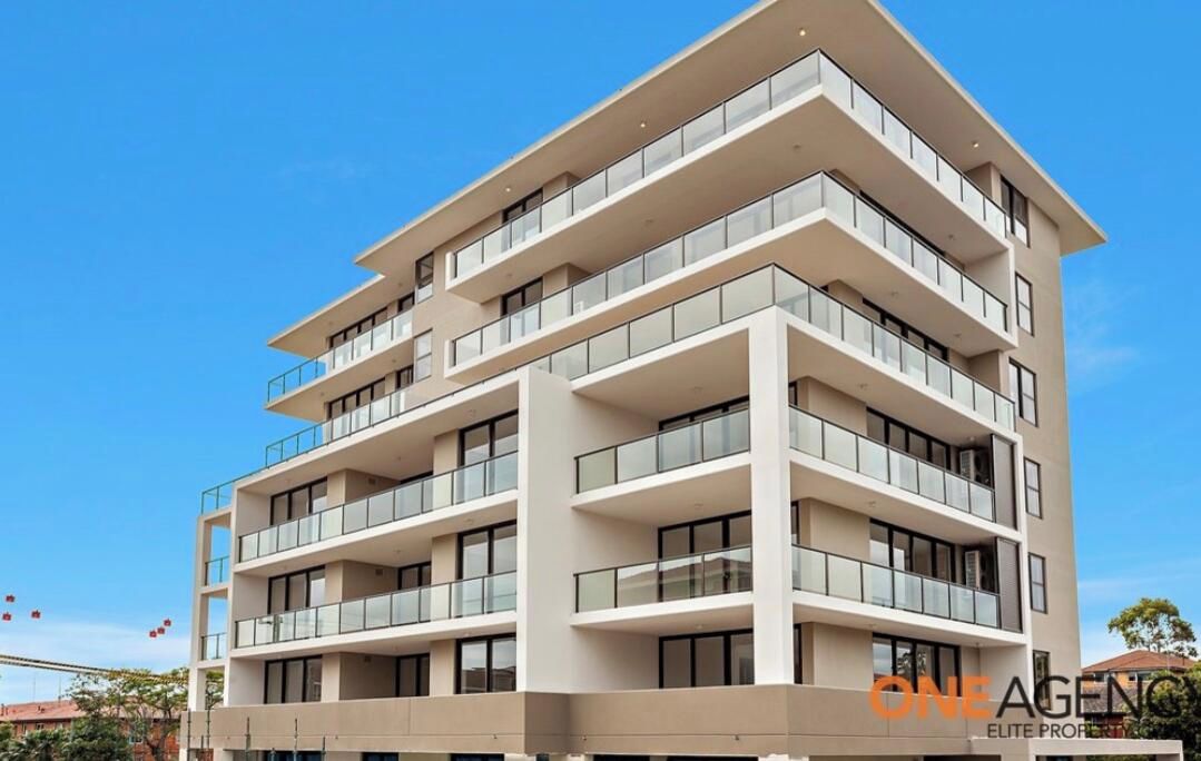 A multi-story building with balconies, likely a hotel or apartment complex.