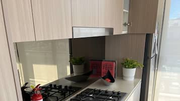 Coffee/tea maker, fridge, microwave, oven