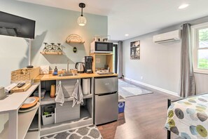 Enjoy cooking in this well-equipped kitchen with a microwave, coffee maker, and refrigerator.