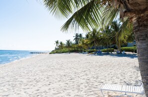 On the beach, sun-loungers, beach towels