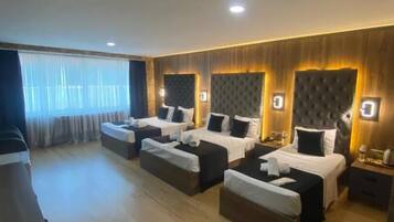 Premium bedding, desk, laptop workspace, soundproofing