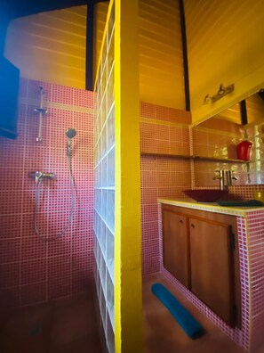 Bathtub, hair dryer, towels, toilet paper