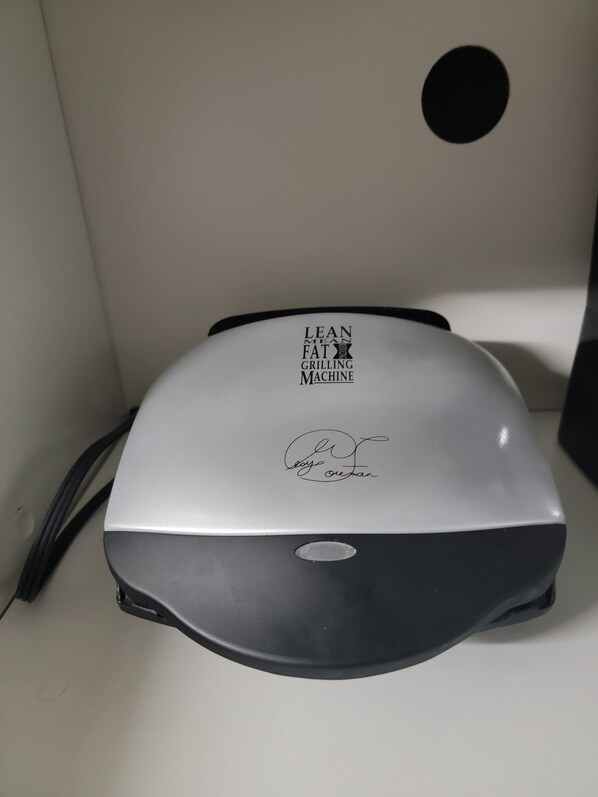 A white and gray object with text and a signature. - Staycation Studio Apartment: full kitchen, washroom, and Free parking (London)